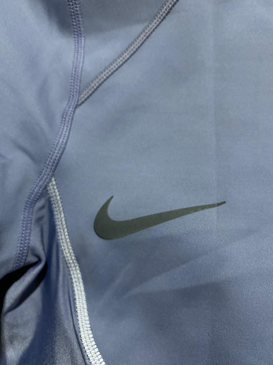 NIKE |M| BUST 16| Cropped Mock-Neck Performance Top in a light periwinkle or lavender blue