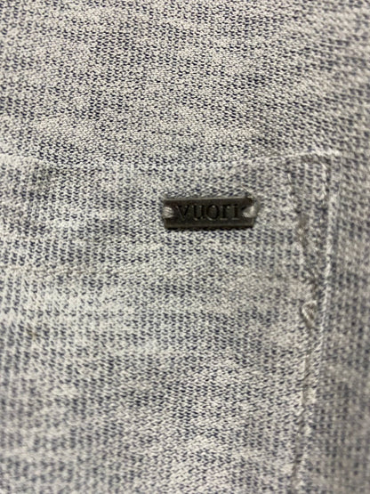 VUORI |M| BUST 21| B12|  The polo shirt has a modern, tailored fit with a self-collar, three-button placket, and a left chest pocket