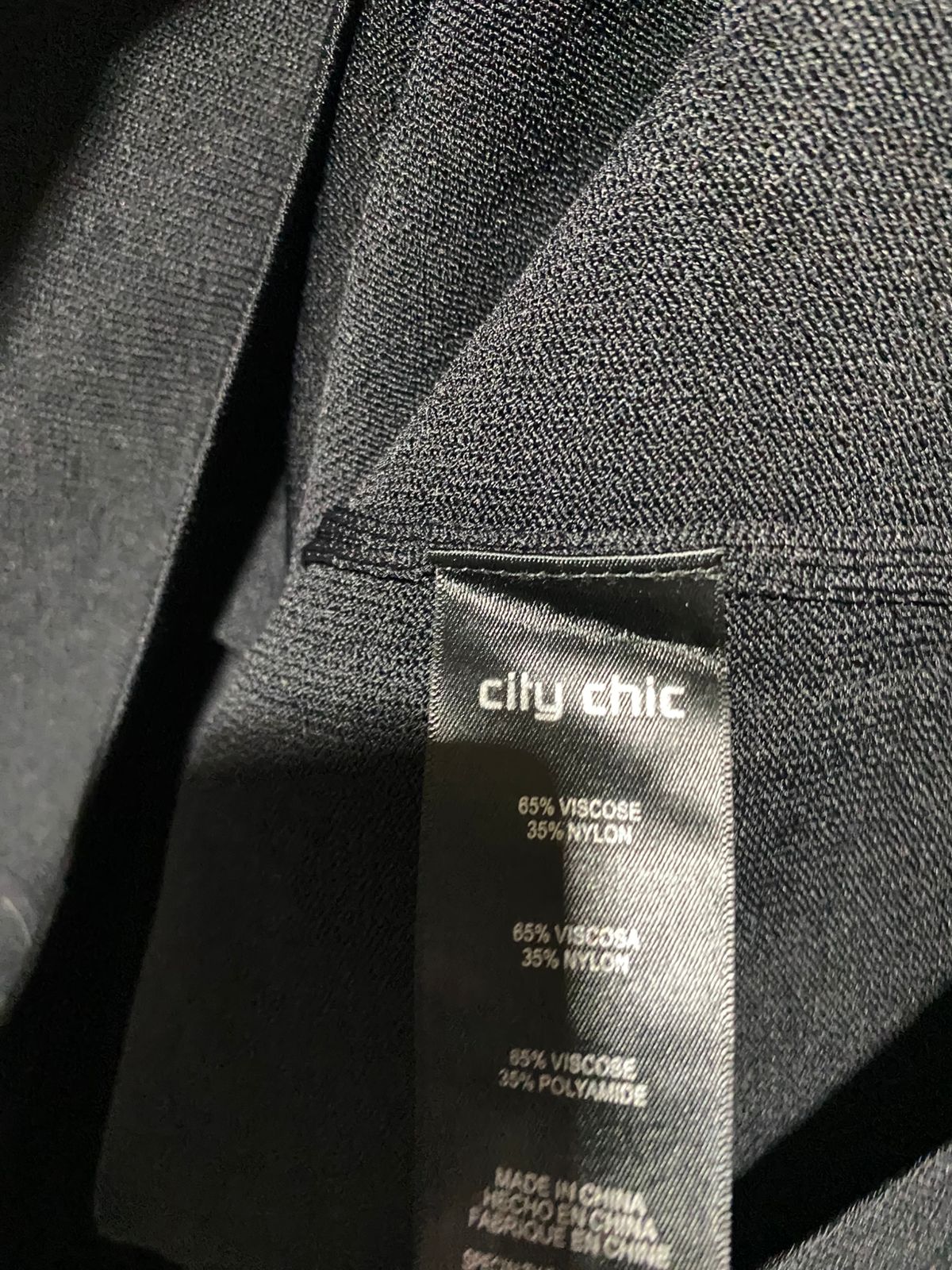 CITY CHIC |L| BUST 23| Black Long-Sleeve Sweater Featuring Silver Grommets or Studs