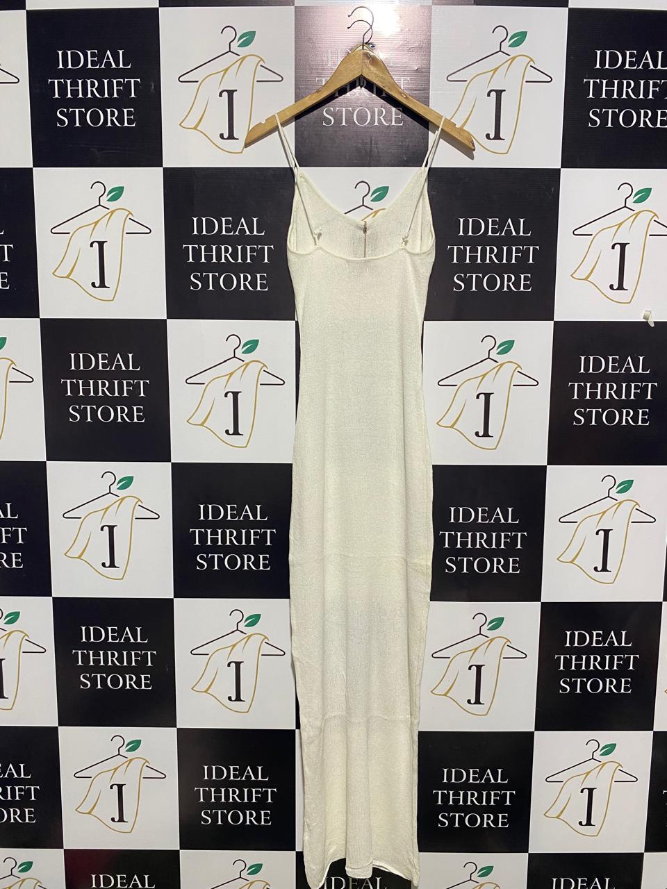 MESHKI |S| BUST 13| EXUDE MINIMALIST SOPHISTICATION IN THIS SLEEK, OFF-WHITE MAXI DRESS