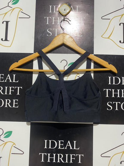 UNDER ARMOUR |S| BUST 13| B5| LADIES BIG LOGO CROSS-BACK SPORTS BRA IN BLACK