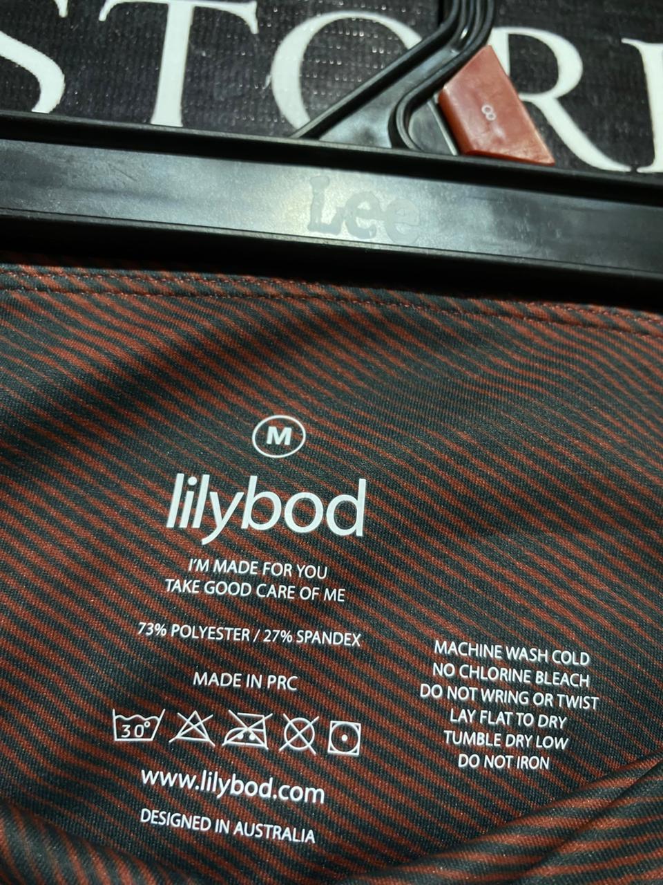 LILYBOD |M| WAIST 26| B23| PREMIUM HIGH-WAISTED RUST CAMO PERFORMANCE BIKER SHORTS