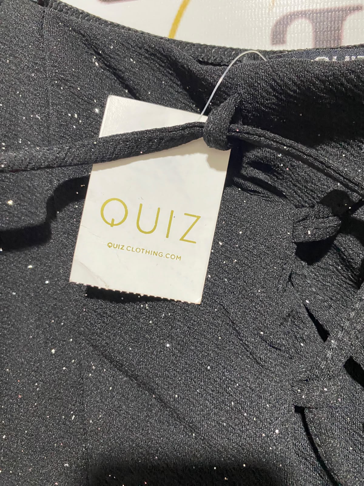 QUIZ |M| BUST 18| A11| LACE-UP FRONT GLITTER PEPLUM TOP - BLACK