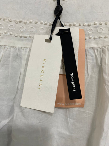 INTROPIA |M| BUST 19| A33| WHITE EYELET EMBROIDERED POM-POM RUFFLE-SHOULDER BLOUSE