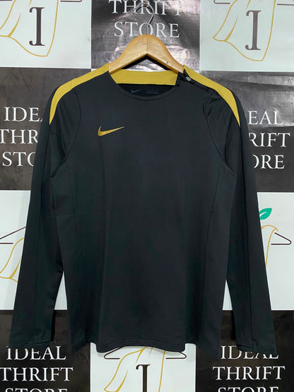 NIKE |S| BUST 17| A40| BLACK AND GOLD DRI-FIT LONG-SLEEVE PERFORMANCE UTILITY TOP