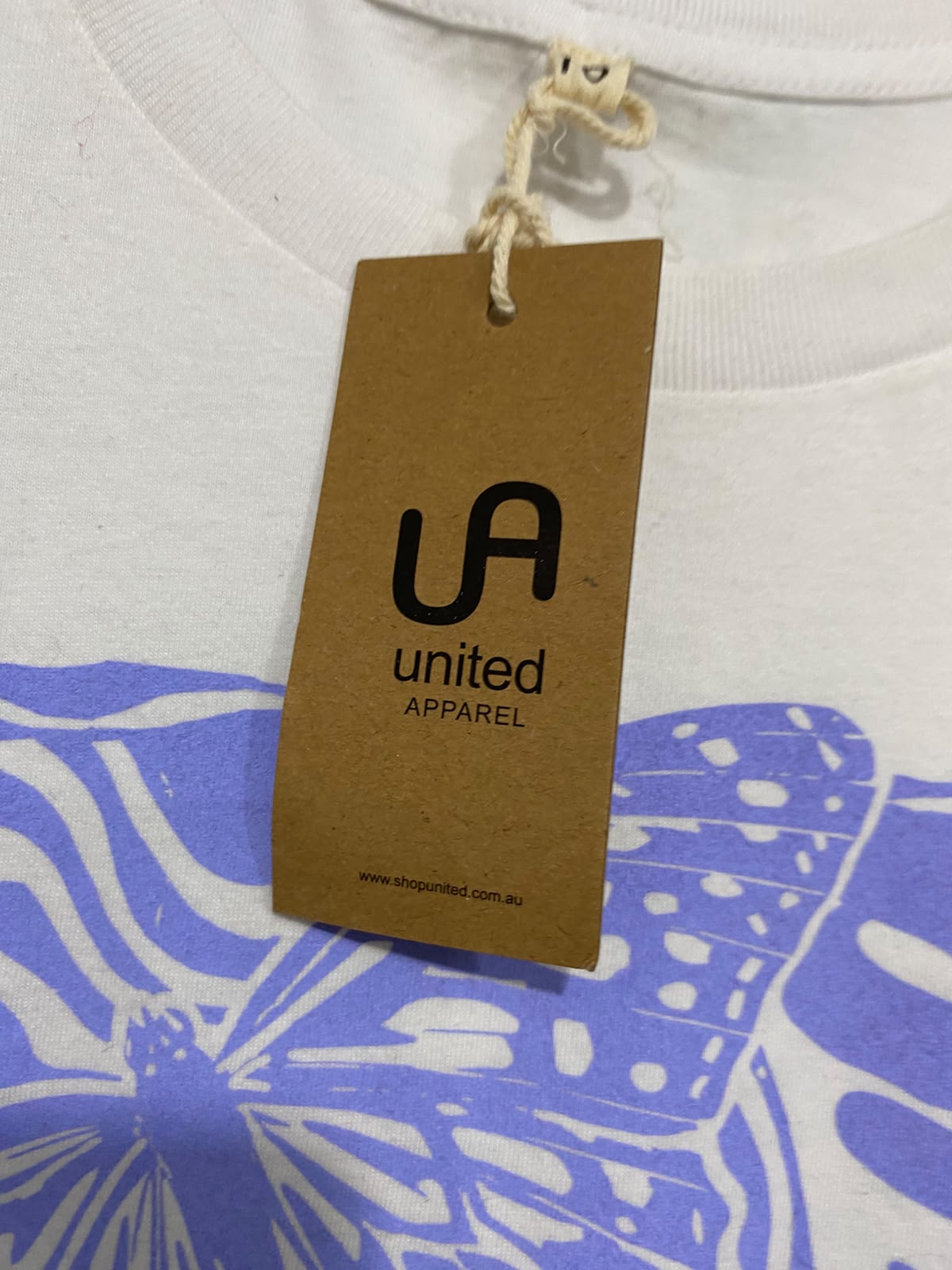 UNITED |L| BUST 21| A43| PURPLE-GRAPHIC WHITE UTILITY TEE